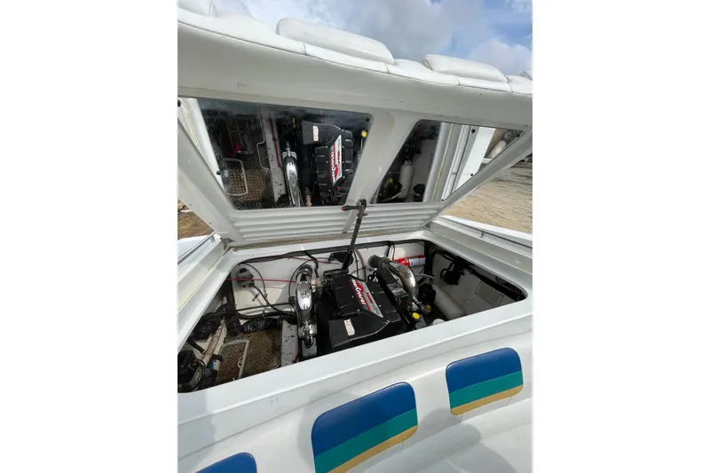 Slide: The Image of Engine compartment of a 1999 Formula 271 FASTech boat, showcasing mechanical components. - 26