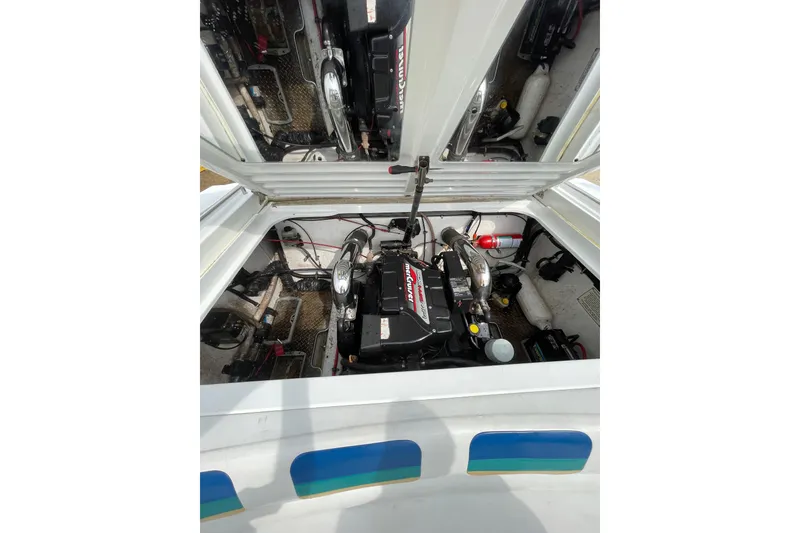 Slide: The Image of Engine compartment of a 1999 Formula 271 FASTech boat, showcasing mechanical components. - 27