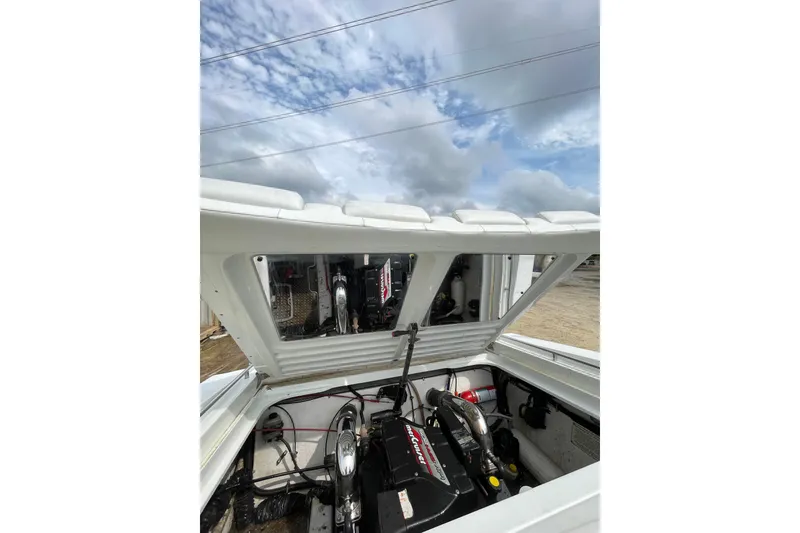 Slide: The Image of 1999 Formula 271 FASTech engine compartment under open hatch, showcasing powerful motor. - 28