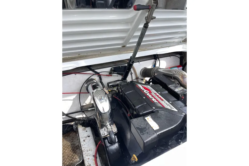 Slide: The Image of Engine compartment of a 1999 Formula 271 FASTech boat, featuring a powerful engine setup. - 36