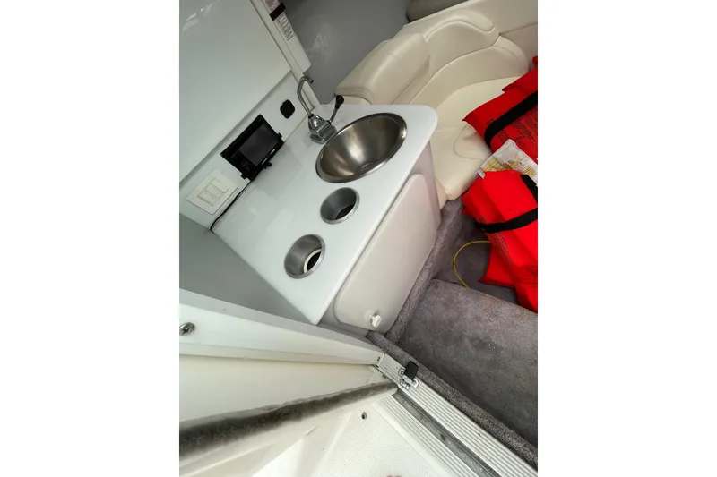 Slide: The Image of Interior of 1999 Formula 271 FASTech boat with sink and seating area. - 39