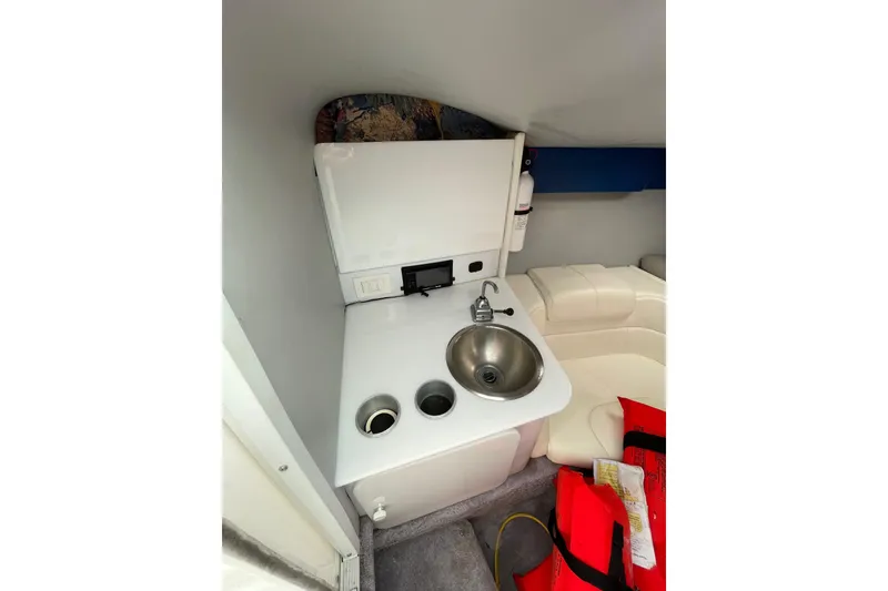 Slide: The Image of 1999 Formula 271 FASTech cabin interior with sink, seating, and life jackets. - 40
