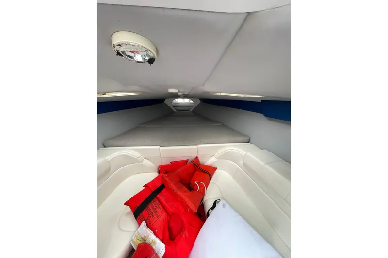 Slide: The Image of Interior of 1999 Formula 271 FASTech boat with white seating and red life jackets. - 41