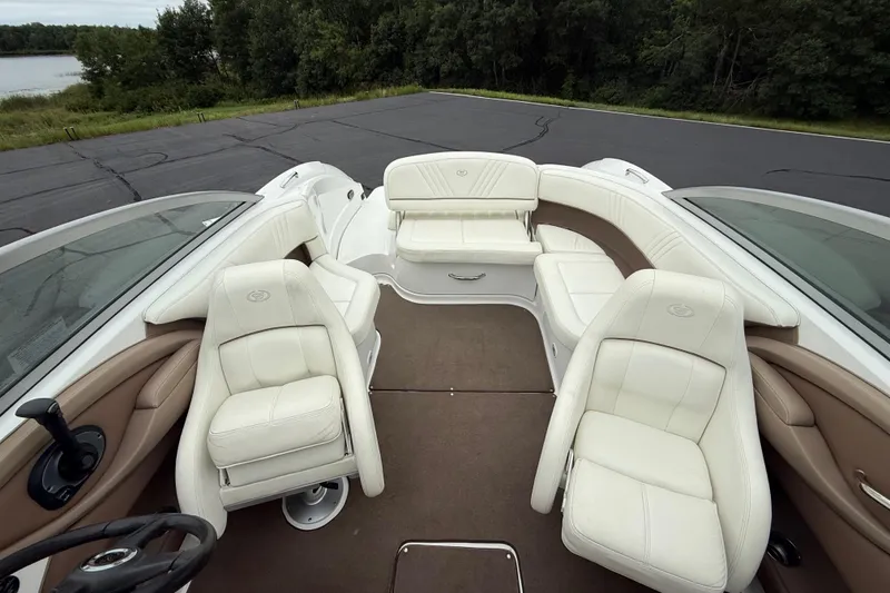 Slide: The Image of Luxurious interior of 2007 Cobalt 232 boat with white leather seating. - 12