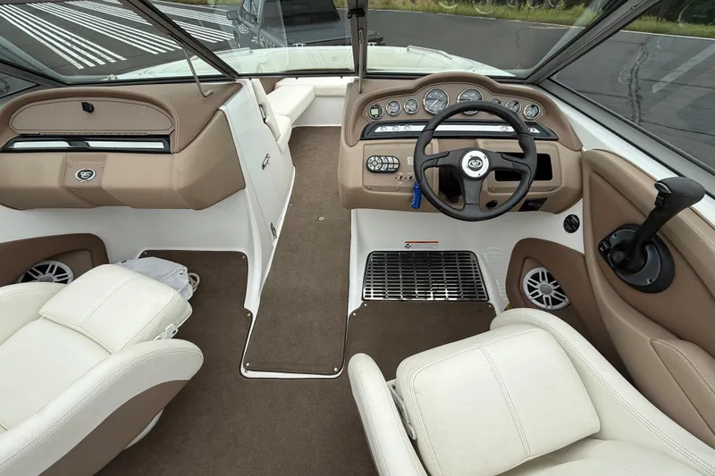 Slide: The Image of Interior of a 2007 Cobalt 232 boat with beige and white seating. - 13