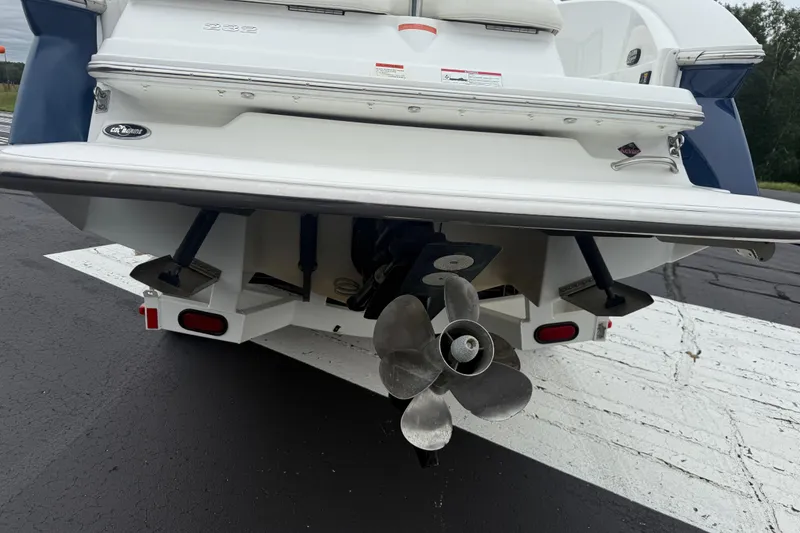 Slide: The Image of Rear view of a 2007 Cobalt 232 boat showing propeller and stern details. - 6