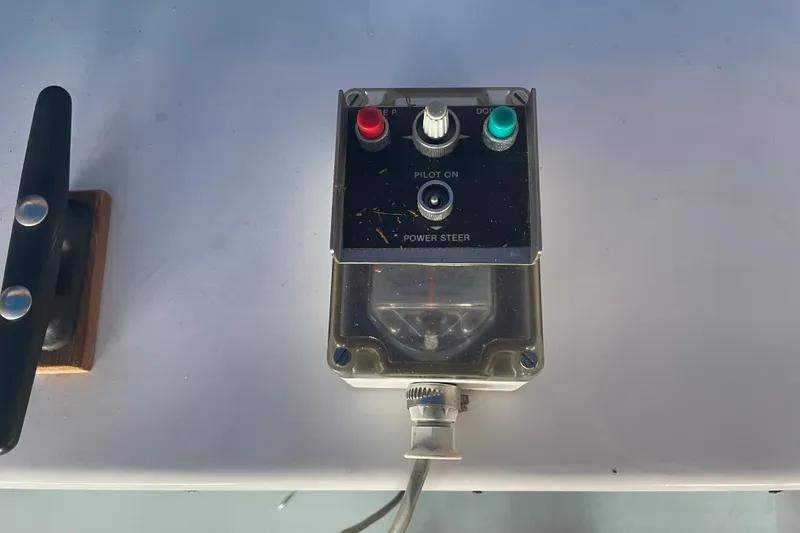 Slide: The Image of Control panel of a 1978 Delta Marine 43 Trawler with power steering feature. - 13