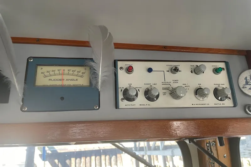 Slide: The Image of Control panel of a 1978 Delta Marine 43 Trawler with rudder angle indicator. - 29