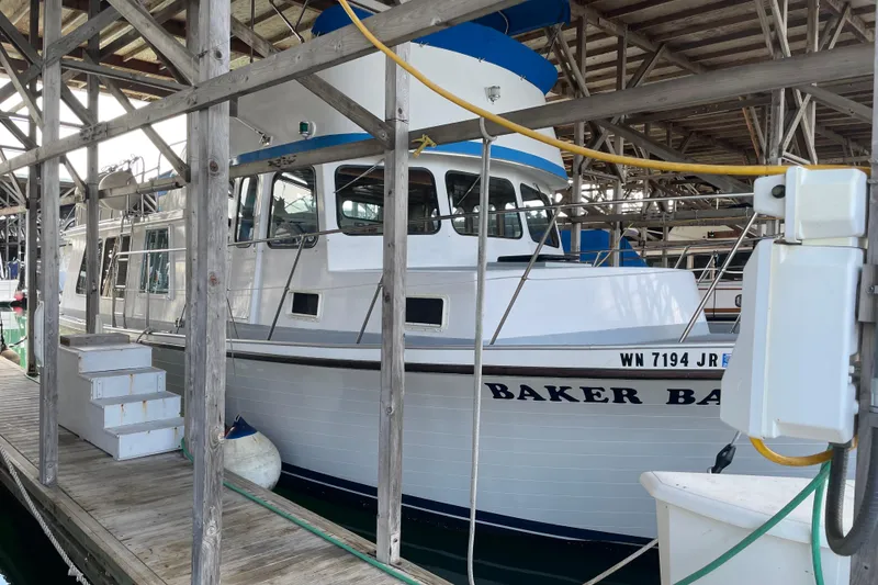 Slide: The Image of 1978 Deltamar 43 Marine boat docked in a covered marina. - 3