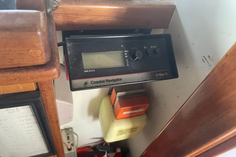 Slide: The Image of Coastal Navigator device on 1978 Delta Marine 43 Trawler, featuring wooden interior details. - 36