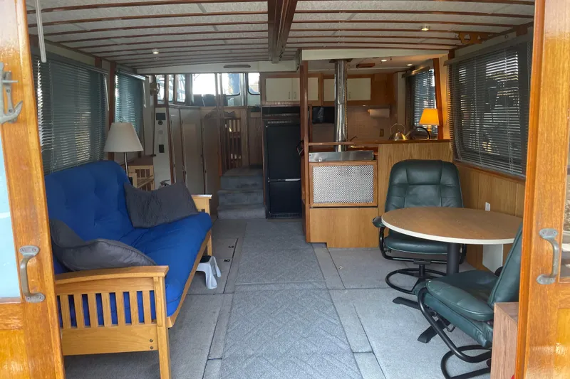 Slide: The Image of Interior of a 1978 Delta Marine 43 Trawler with cozy seating and dining area. - 45