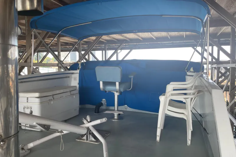 Slide: The Image of 1978 Delta Marine 43 Trawler deck with blue canopy and seating area. - 5