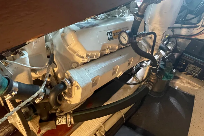 Slide: The Image of Engine room of a 1978 Delta Marine 43 Trawler, featuring mechanical components and gauges. - 54