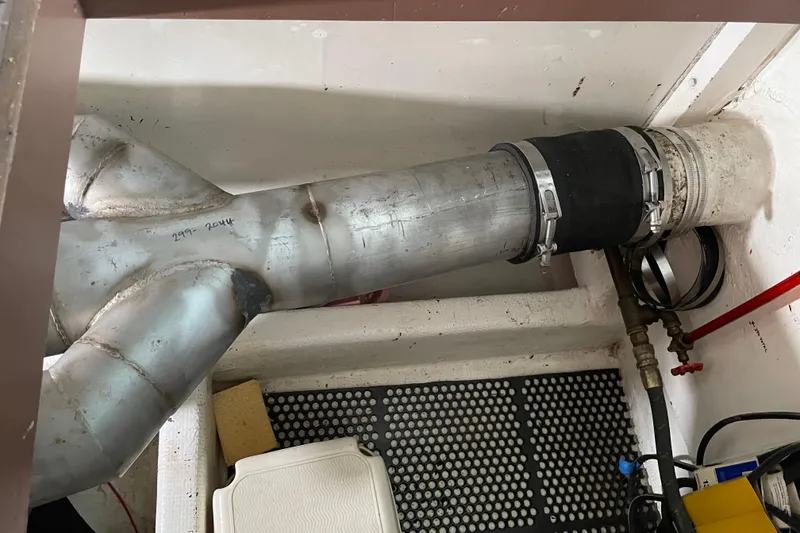 Slide: The Image of Engine room of 1978 Delta Marine 43 Trawler with metal exhaust pipe system. - 55