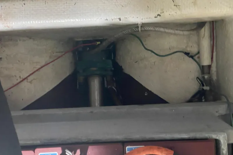 Slide: The Image of Engine compartment of a 1978 Delta Marine 43 Trawler, showing wiring and mechanical components. - 56