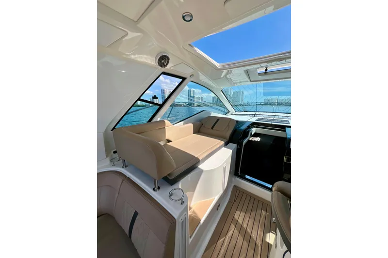 Slide: The Image of Interior of 2017 Sea Ray Sundancer 350 Coupe with luxurious seating and ocean view. - 21