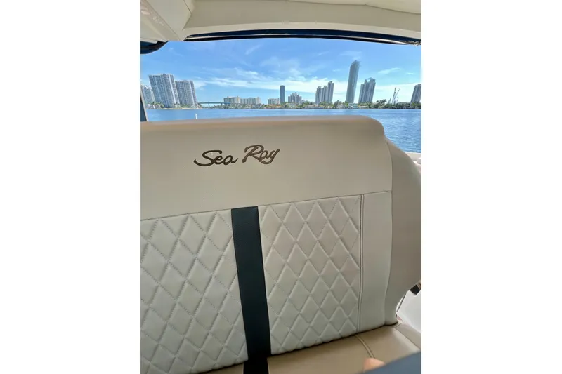 Slide: The Image of 2017 Sea Ray Sundancer 350 Coupe interior with city skyline view. - 38
