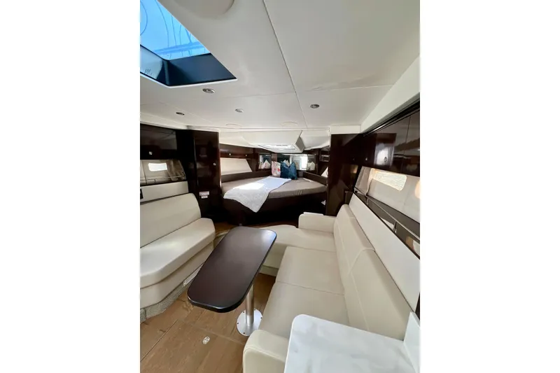 Slide: The Image of Luxurious interior of 2017 Sea Ray Sundancer 350 Coupe with elegant seating and cozy bed. - 42