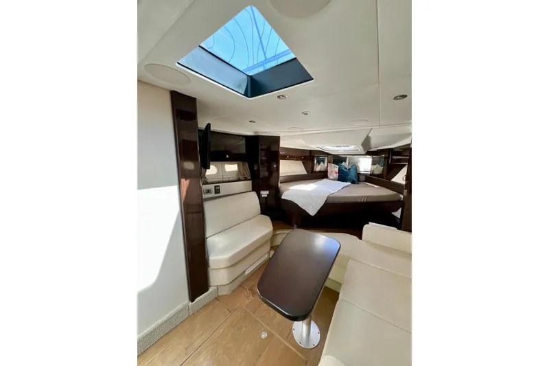 Slide: The Image of Luxurious interior of 2017 Sea Ray Sundancer 350 Coupe with skylight and cozy seating. - 43