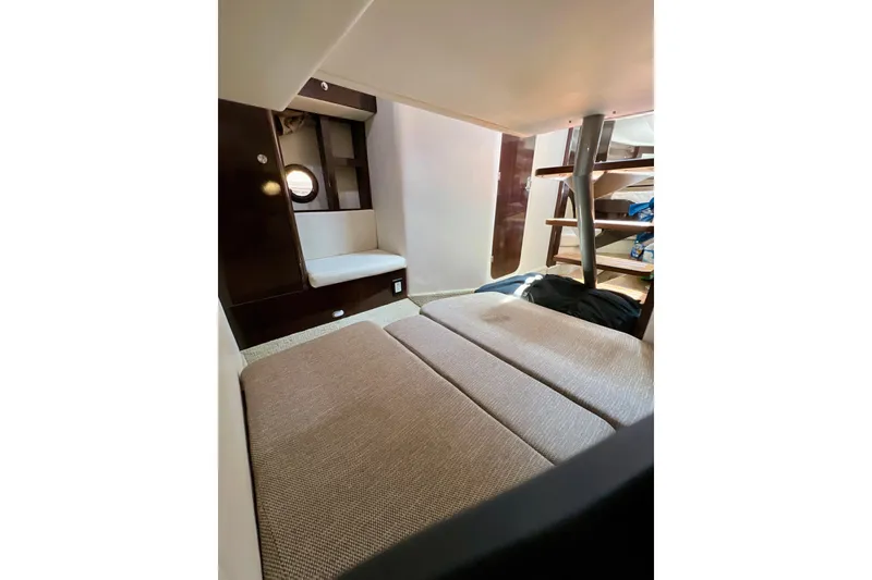 Slide: The Image of 2017 Sea Ray Sundancer 350 Coupe interior cabin with seating and stairs. - 48