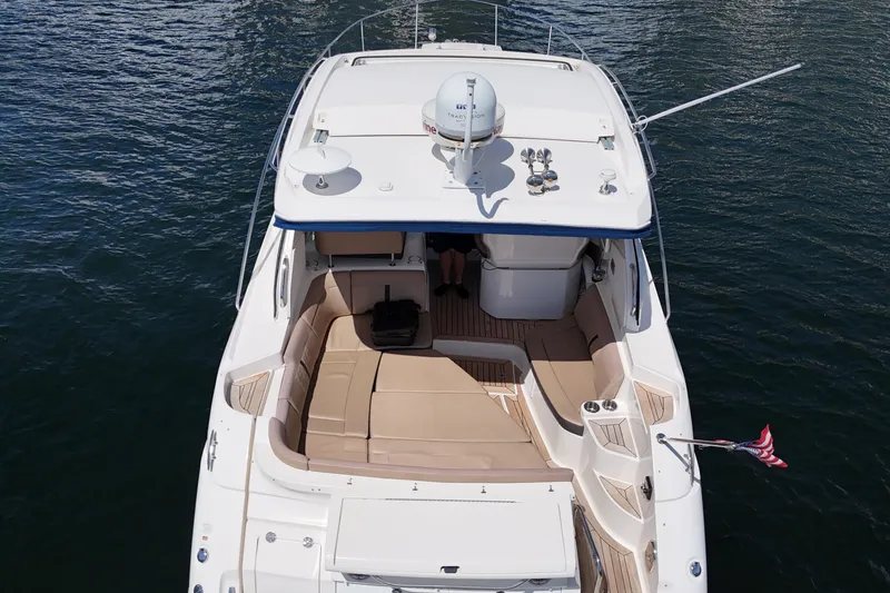Slide: The Image of Overhead view of 2017 Sea Ray Sundancer 350 Coupe on water, featuring spacious deck seating. - 6