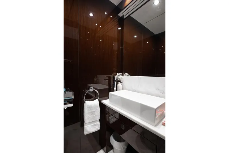 Slide: The Image of Luxurious bathroom interior on a 2018 Sunseeker 95 Yacht, featuring modern sink and elegant design. - 14