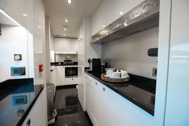 Slide: The Image of Luxurious kitchen interior of 2018 Sunseeker 95 Yacht with modern appliances and sleek design. - 15