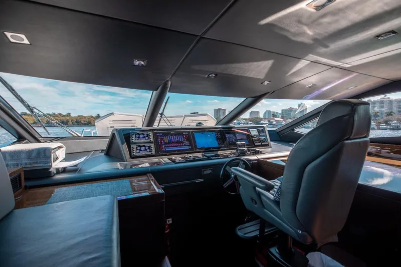 Slide: The Image of Luxurious 2018 Sunseeker 95 Yacht cockpit with advanced navigation systems and panoramic views. - 17