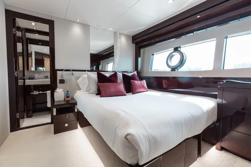 Slide: The Image of Luxurious bedroom interior of 2018 Sunseeker 95 Yacht with elegant furnishings and large windows. - 37