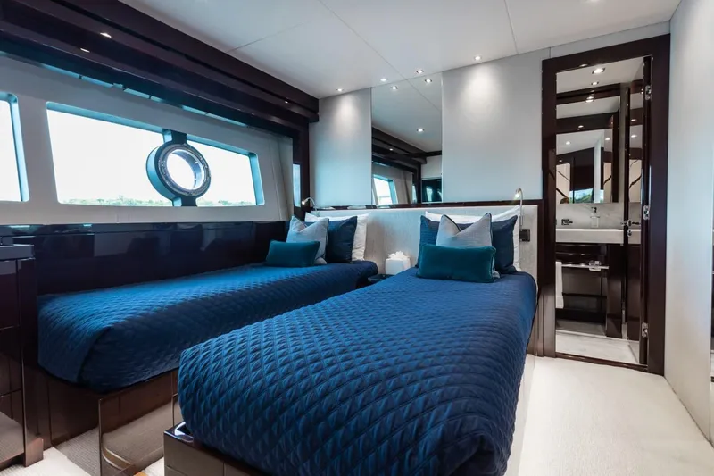 Slide: The Image of Luxurious twin bedroom on 2018 Sunseeker 95 Yacht with elegant blue bedding. - 42