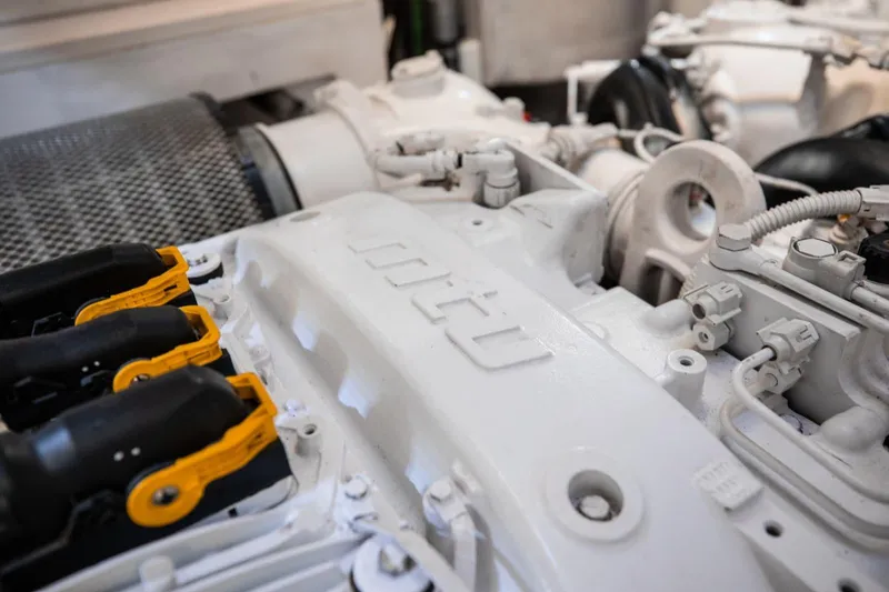 Slide: The Image of Engine room of a 2018 Sunseeker 95 Yacht, showcasing detailed mechanical components. - 43