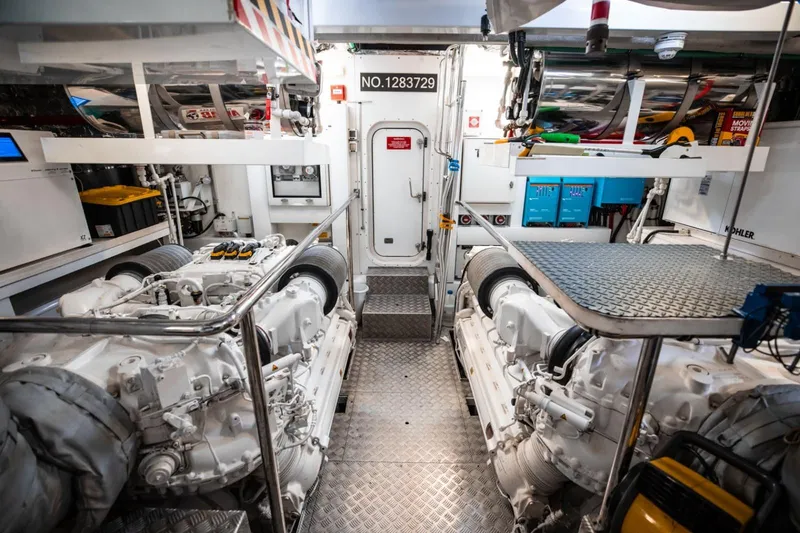 Slide: The Image of Engine room of a 2018 Sunseeker 95 Yacht, showcasing dual engines and equipment. - 47