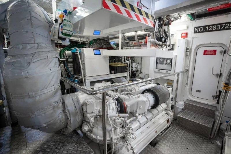 Slide: The Image of Engine room of a 2018 Sunseeker 95 Yacht, showcasing machinery and equipment. - 48