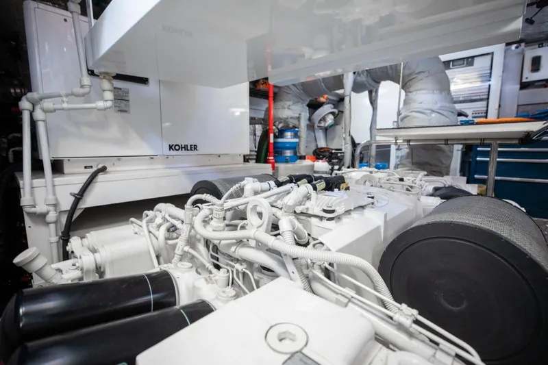 Slide: The Image of Engine room of 2018 Sunseeker 95 Yacht featuring Kohler generator and mechanical components. - 50