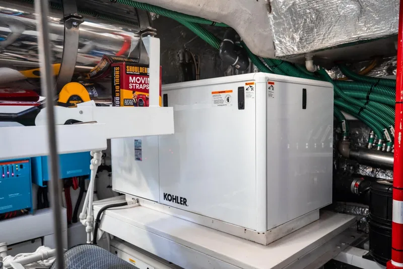 Slide: The Image of Engine room of 2018 Sunseeker 95 Yacht featuring Kohler generator and equipment. - 51