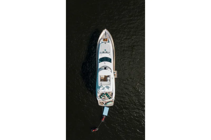 Slide: The Image of Aerial view of 2018 Sunseeker 95 Yacht on dark water. - 6