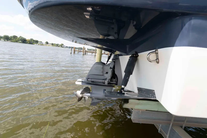 Slide: The Image of 2019 Rinker 290 EX boat stern with propeller in water. - 12