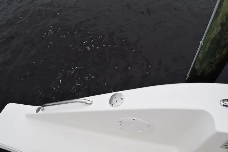 Slide: The Image of Close-up of a metal knob on a 2022 Pursuit OS 355 Offshore boat. - 113