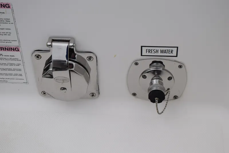 Slide: The Image of Open storage compartment on 2022 Pursuit OS 355 Offshore boat. - 125