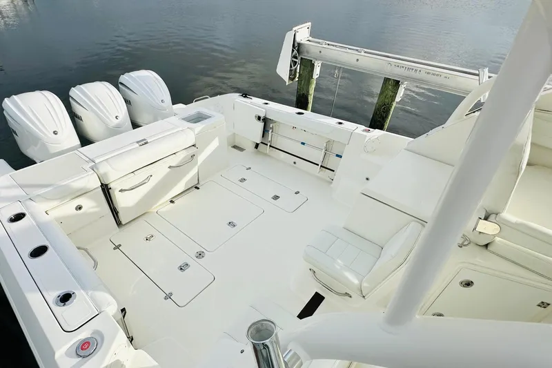 Slide: The Image of Battery compartment of 2022 Pursuit OS 355 Offshore boat with wiring and components. - 14