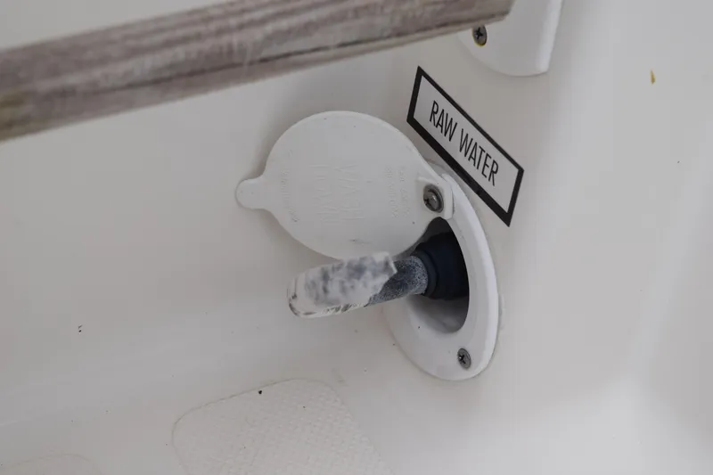 Slide: The Image of 2022 Pursuit OS 355 Offshore boat storage compartments with open hatches and visible equipment. - 150