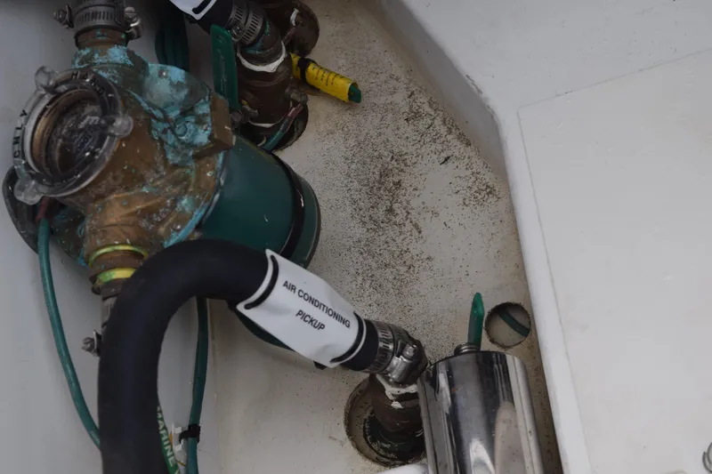 Slide: The Image of Control panel of a 2022 Pursuit OS 355 Offshore boat, featuring engine and electronics switches. - 168