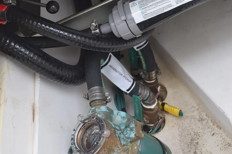 Slide: The Image of Control panel of a 2022 Pursuit OS 355 Offshore boat with various switches and indicators. - 169