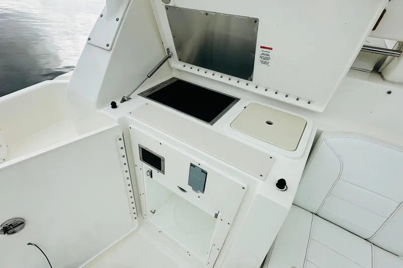 Slide: The Image of 2022 Pursuit OS 355 Offshore boat top view under cloudy sky. - 17