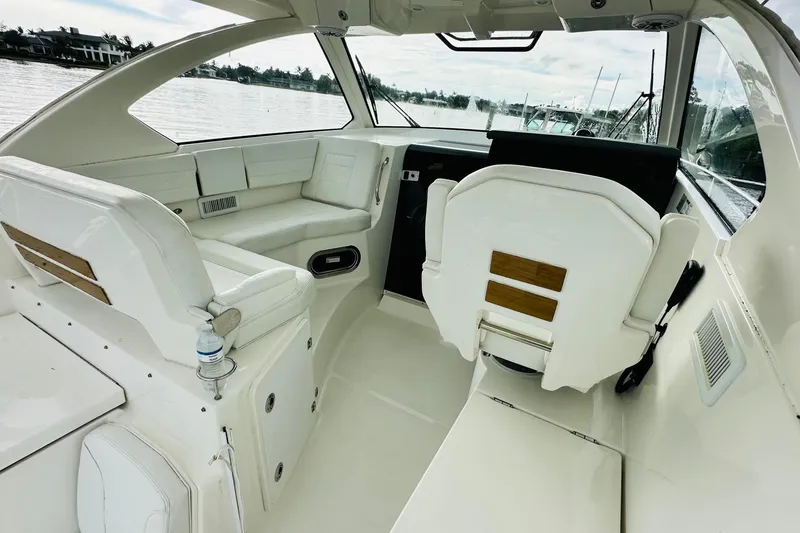 Slide: The Image of 2022 Pursuit OS 355 Offshore boat roof with speakers and lighting fixtures. - 18