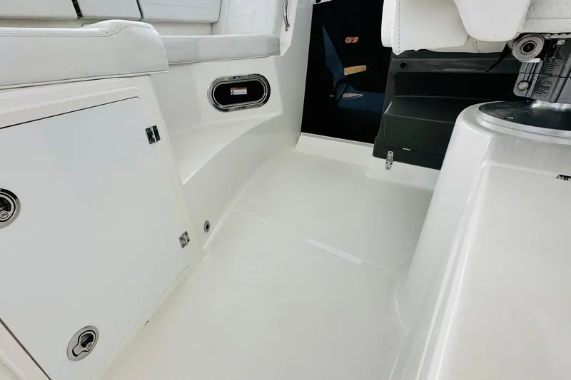 Slide: The Image of 2022 Pursuit OS 355 Offshore boat roof with antenna and speaker, under cloudy sky. - 19