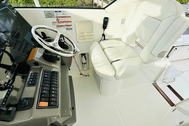 Slide: The Image of 2022 Pursuit OS 355 Offshore boat ceiling with speakers and lighting fixtures. - 22