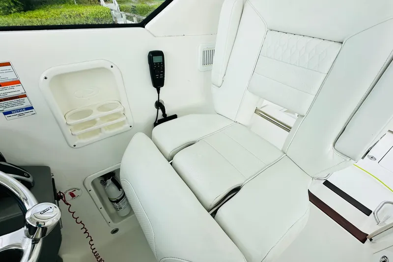 Slide: The Image of 2022 Pursuit OS 355 Offshore boat ceiling with speaker and light fixture. - 24