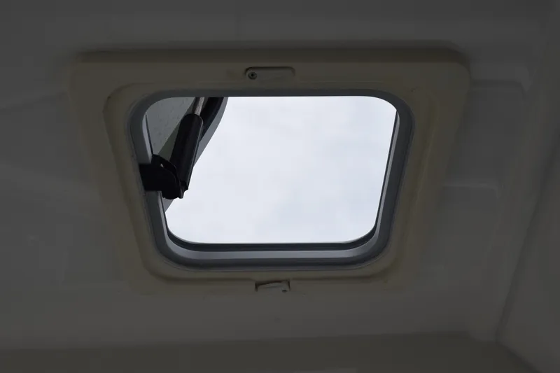 Slide: The Image of 2022 Pursuit OS 355 Offshore boat seat, white leather upholstery, modern design. - 257