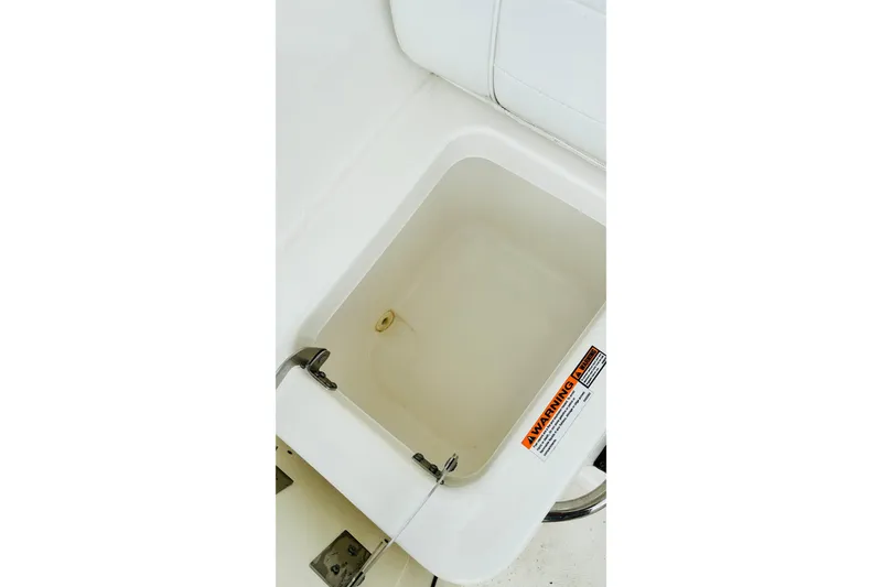 Slide: The Image of 2022 Pursuit OS 355 Offshore boat interior with white seating and steps. - 30